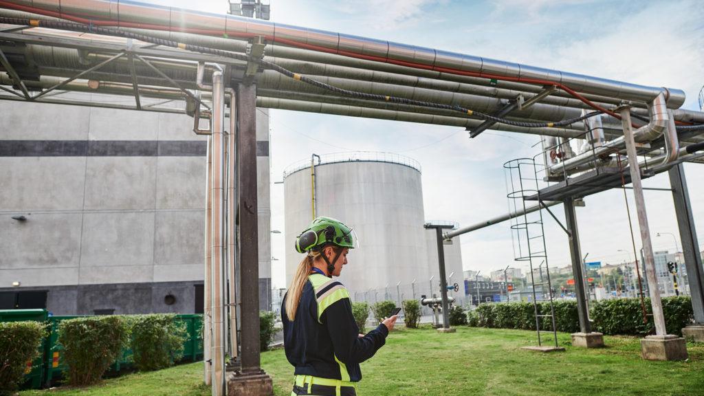 Site worker using mobile device at a site